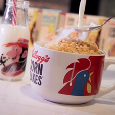 Corn Flakes bowl and Coco Pops milk bottle with mini cereal boxes in the background
